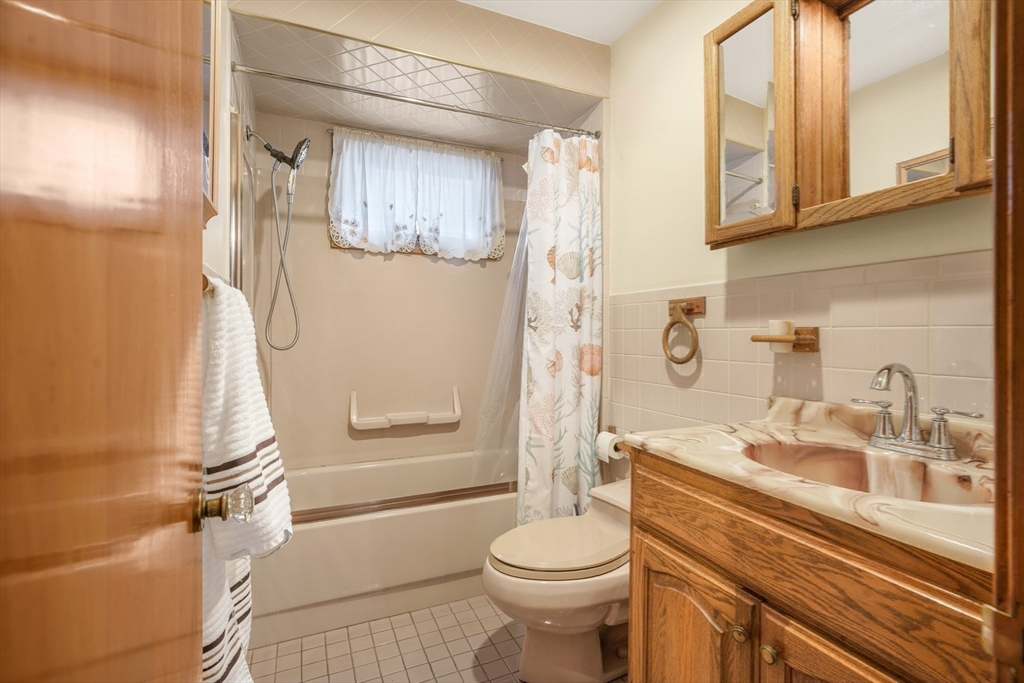 256 Rhode Island Avenue Fall River, MA 02724 - Photo 24 of 36 a bathroom with a sink a toilet and shower
