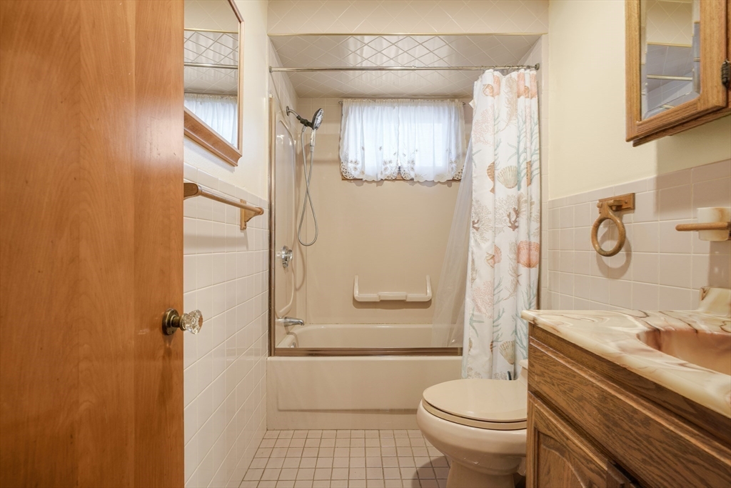 256 Rhode Island Avenue Fall River, MA 02724 - Photo 25 of 36 a bathroom with a granite countertop sink toilet and shower