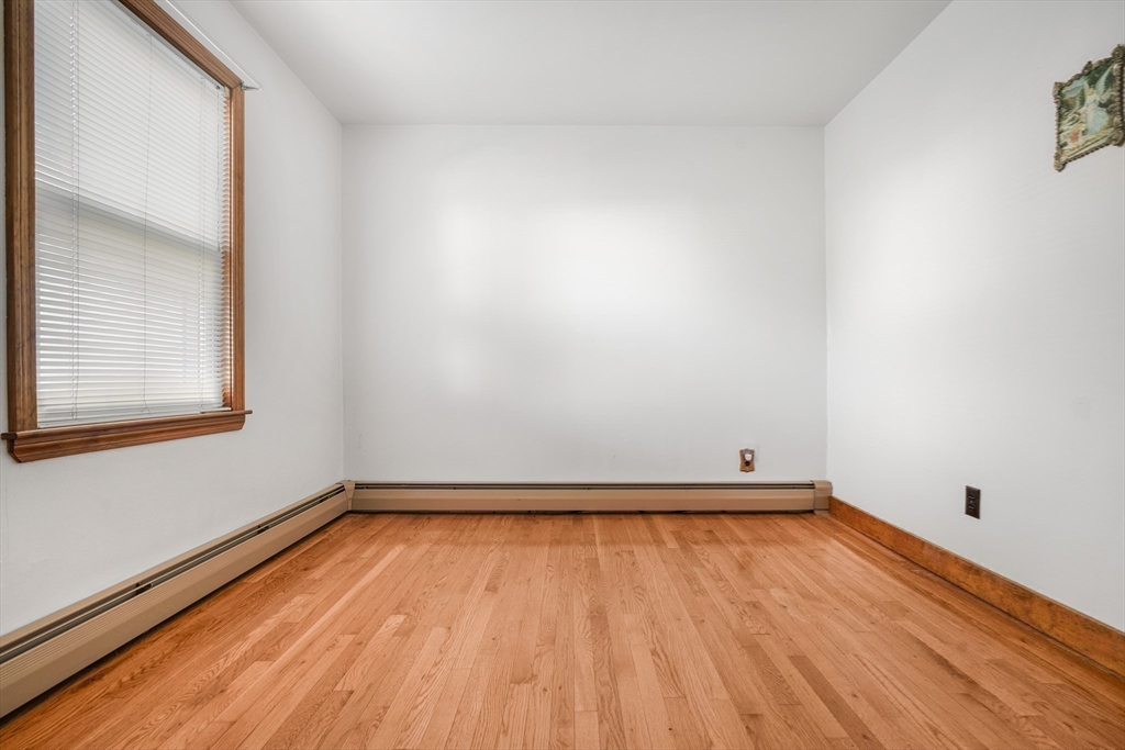 256 Rhode Island Avenue Fall River, MA 02724 - Photo 28 of 36 a view of a room with wooden floor and fence