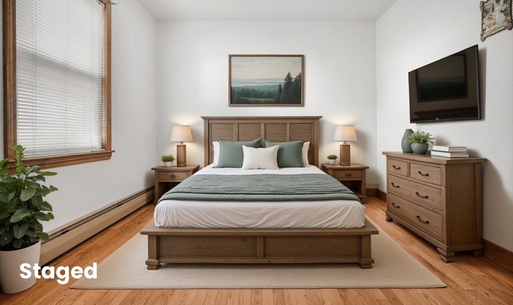 256 Rhode Island Avenue Fall River, MA 02724 - Photo 6 of 36 a bedroom with a bed and flat screen tv