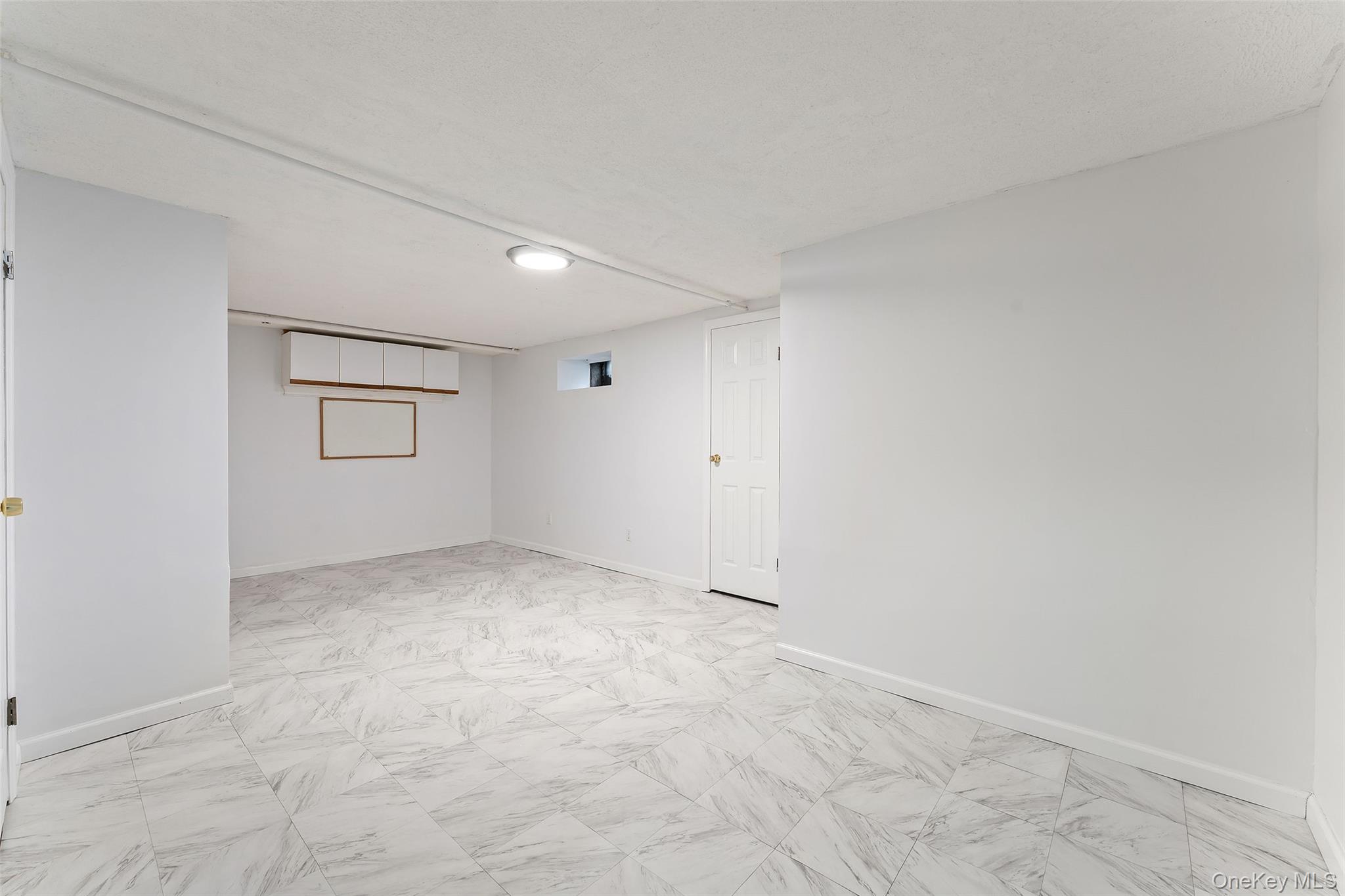 14 Wakefield Road Scarsdale, NY 10583 - Photo 22 of 27 Partially finished basement. (Laundry is in separate part of basement)