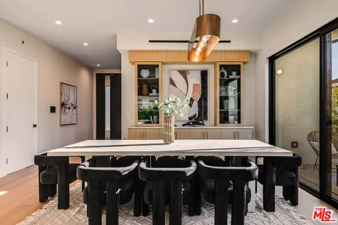 a view of a dining room with furniture and window
