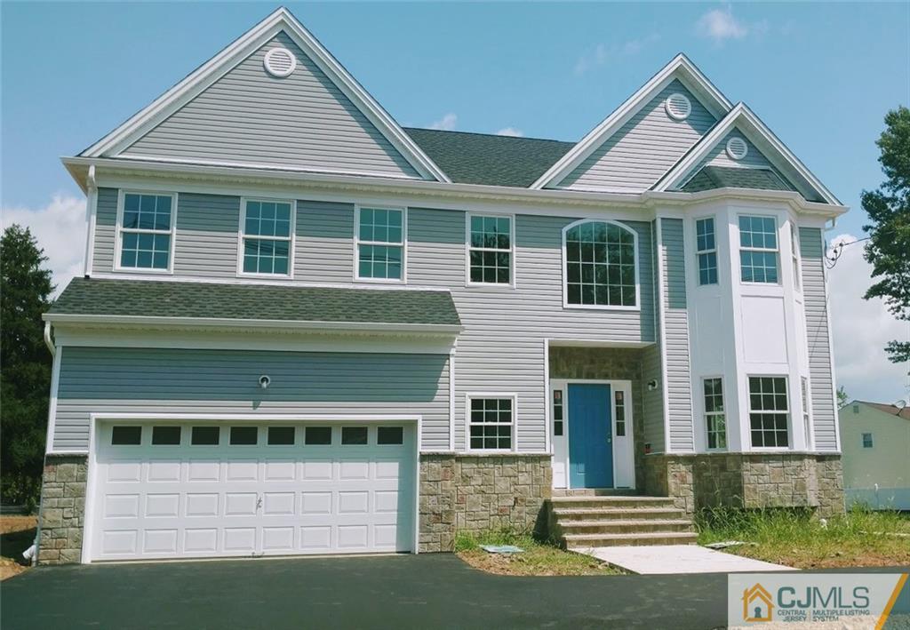 2028 Oak Tree Road Edison, NJ 08820 - Photo 1 of 39 a front view of a house with a yard