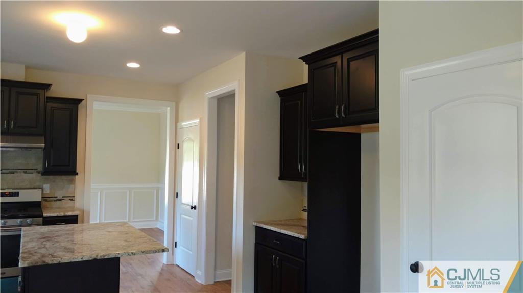 2028 Oak Tree Road Edison, NJ 08820 - Photo 5 of 39 a view of a kitchen from the hallway