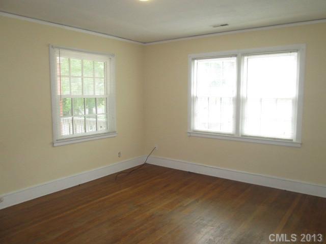 516 Grandin Road, Unit 3 Charlotte, NC 28208 - Photo 2 of 7 a view of a room with wooden floor and windows