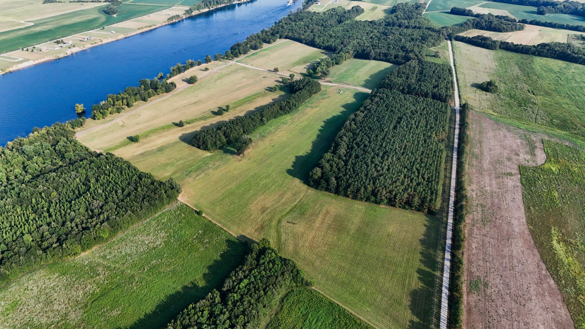 a view of a lake with a yard