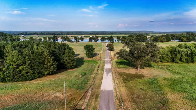 a view of a lake with green space