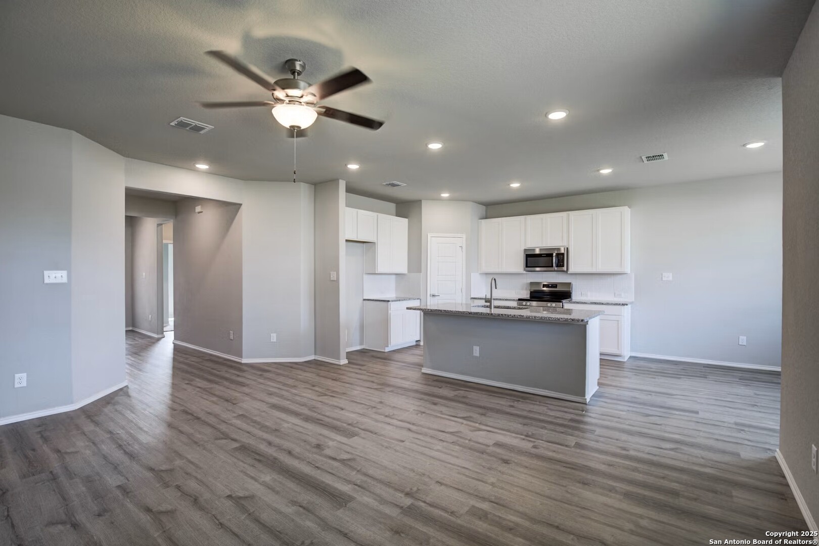 3453 Meteor Night Converse, TX 78109 - Photo 5 of 22 a view of kitchen with refrigerator microwave and stove