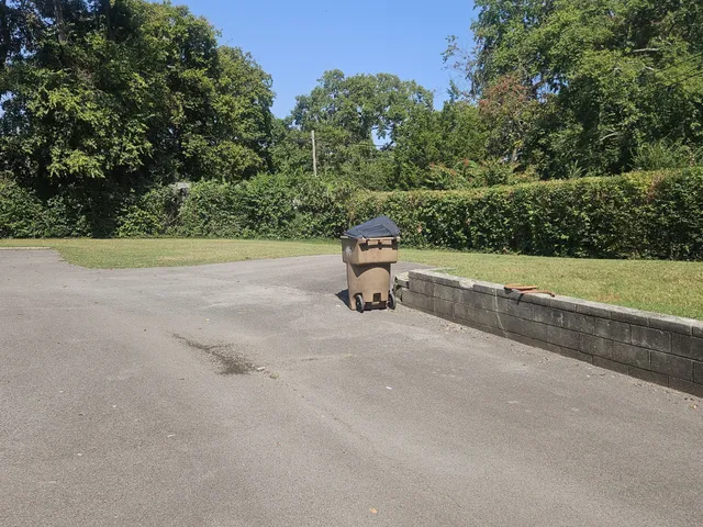 a backyard of a house with a table and chairs