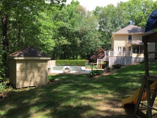17 Virginia Road Tyngsborough, MA 01879 - Photo 15 of 19 a view of backyard with a garden and plants