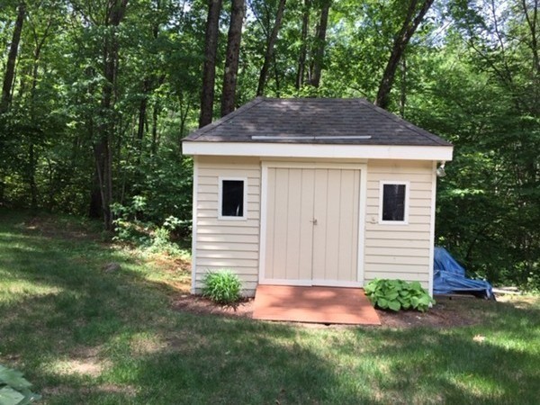 17 Virginia Road Tyngsborough, MA 01879 - Photo 17 of 19 a front view of a house with garden