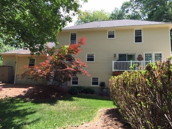 17 Virginia Road Tyngsborough, MA 01879 - Photo 18 of 19 a view of a house with a yard and plants