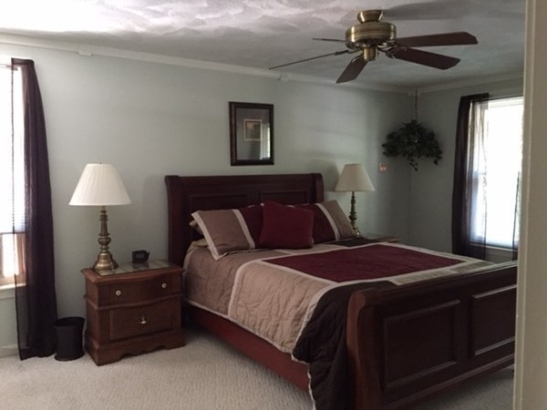 17 Virginia Road Tyngsborough, MA 01879 - Photo 6 of 19 a bedroom with a bed and a lamp