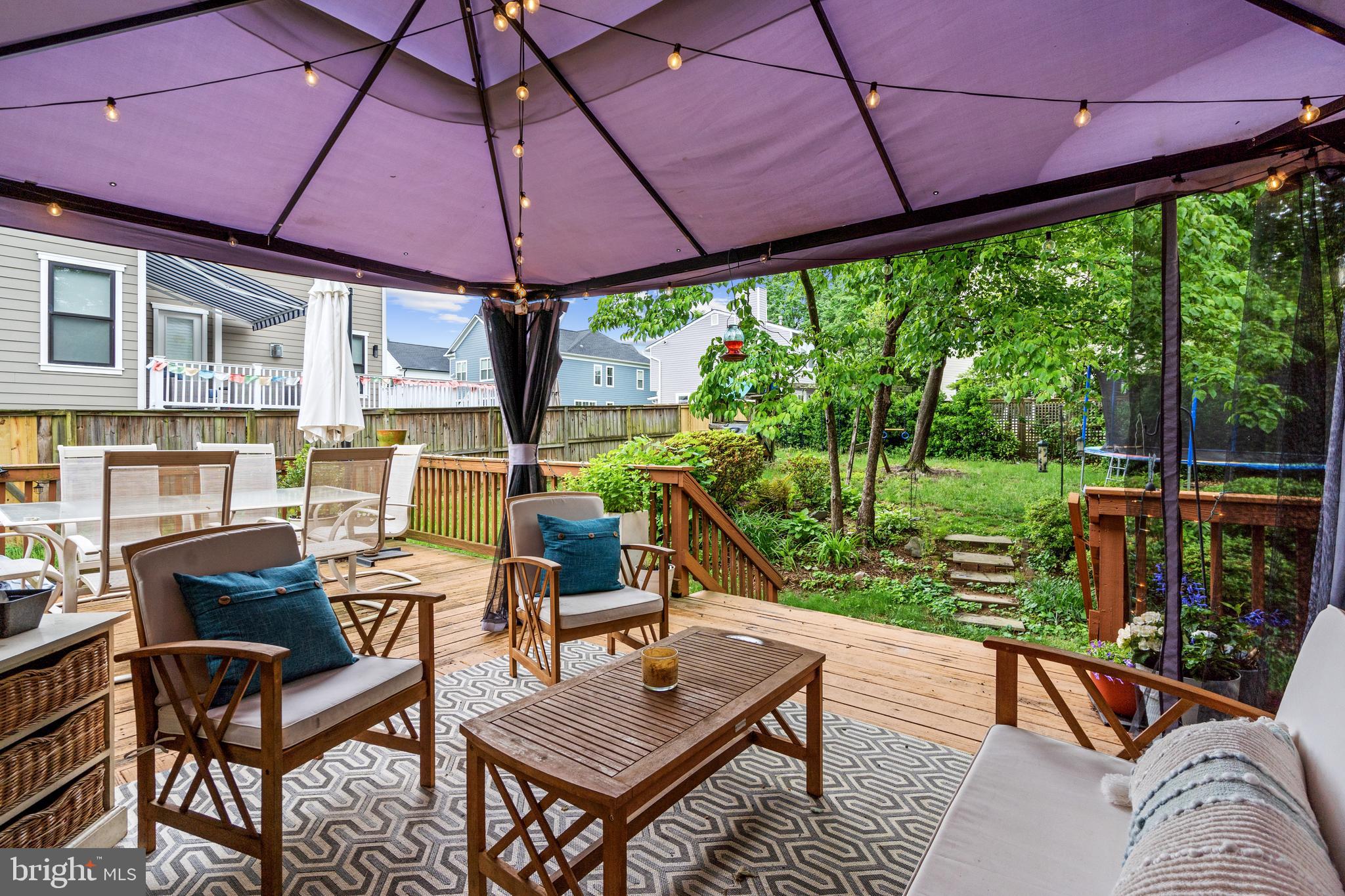 6823 Churchill Road McLean, VA 22101 - Photo 12 of 40 a patio with yard glass top table and chairs