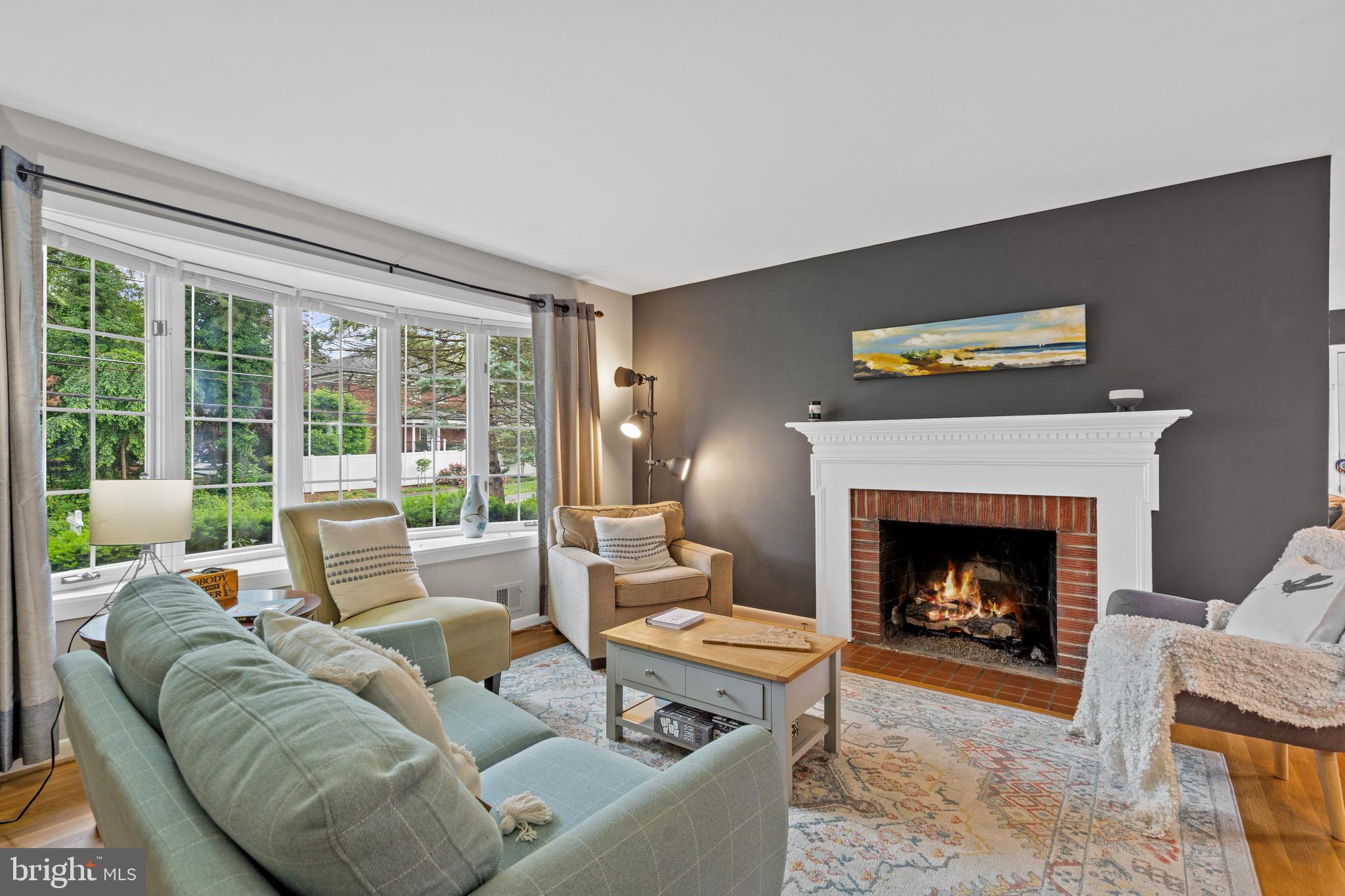 6823 Churchill Road McLean, VA 22101 - Photo 15 of 40 a living room with furniture and a fireplace