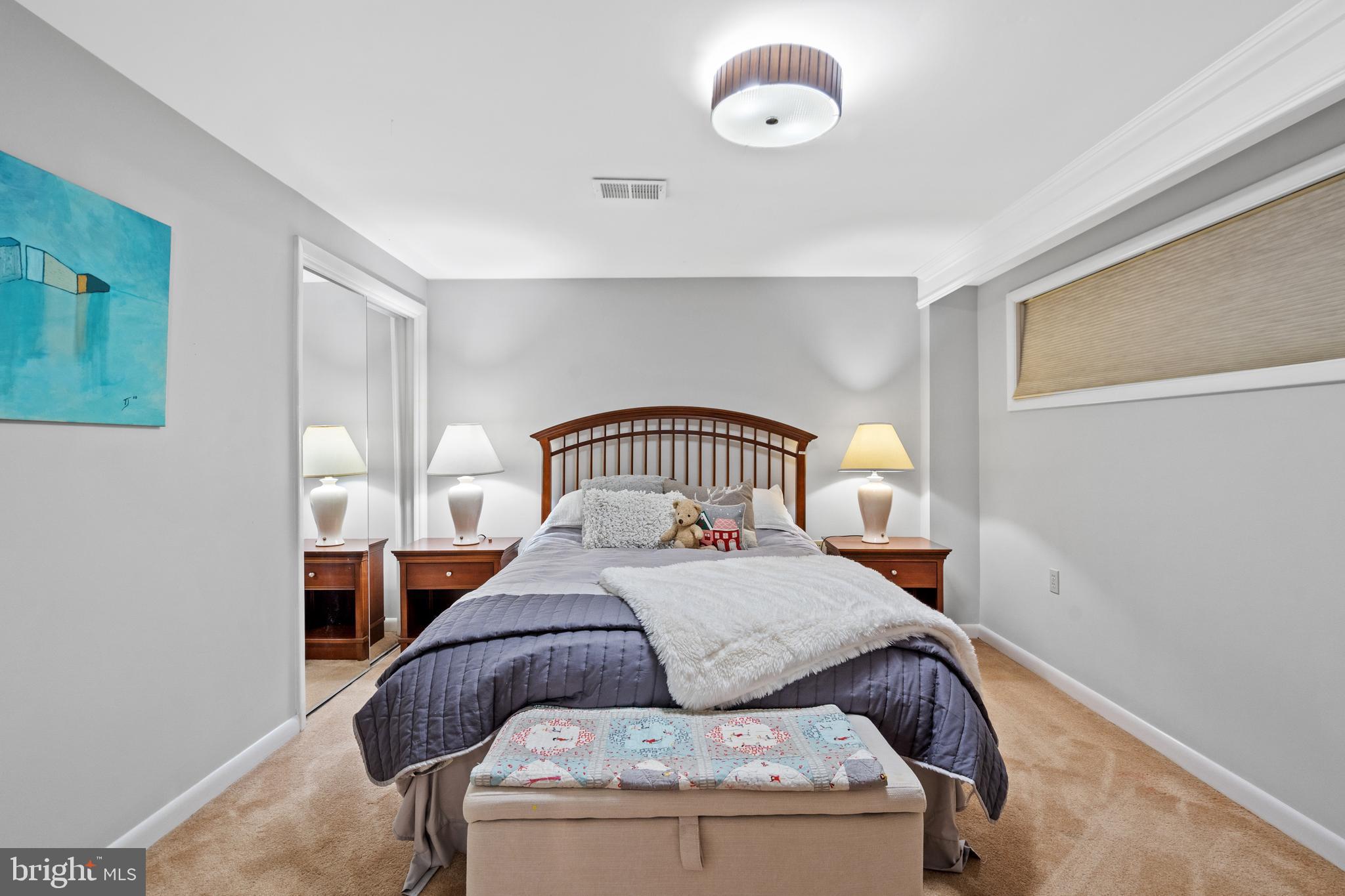 6823 Churchill Road McLean, VA 22101 - Photo 35 of 40 a bedroom with a bed and window