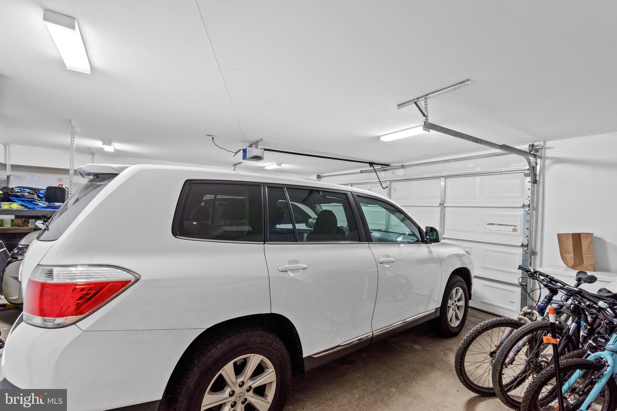 6823 Churchill Road McLean, VA 22101 - Photo 40 of 40 a view of a car garage of a bike and car