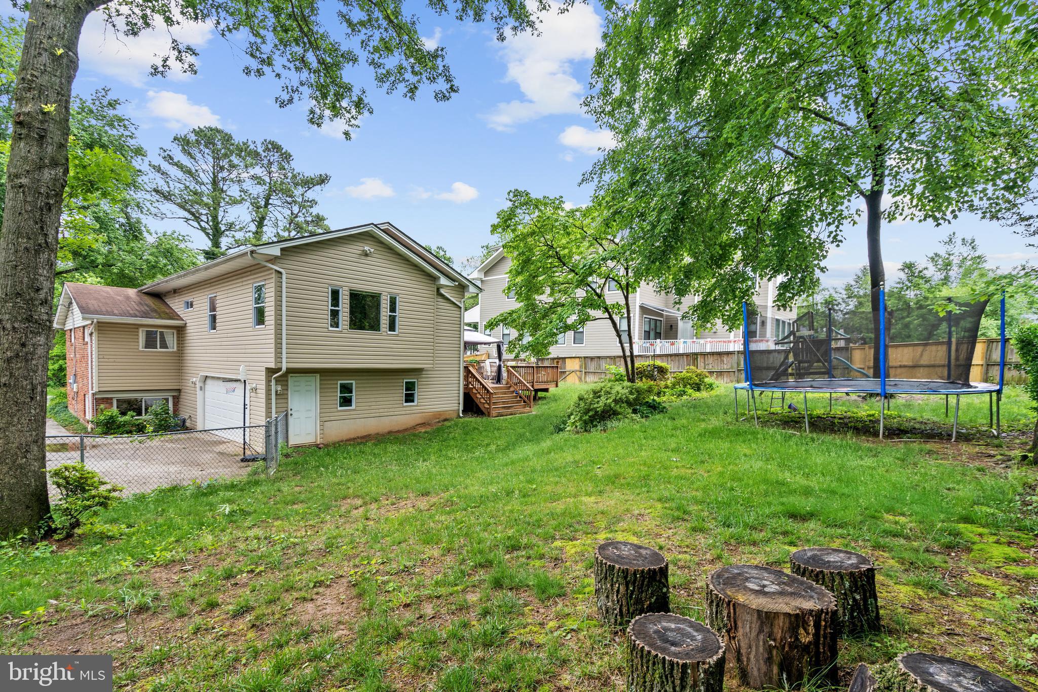 6823 Churchill Road McLean, VA 22101 - Photo 6 of 40 a view of a house with backyard and sitting area