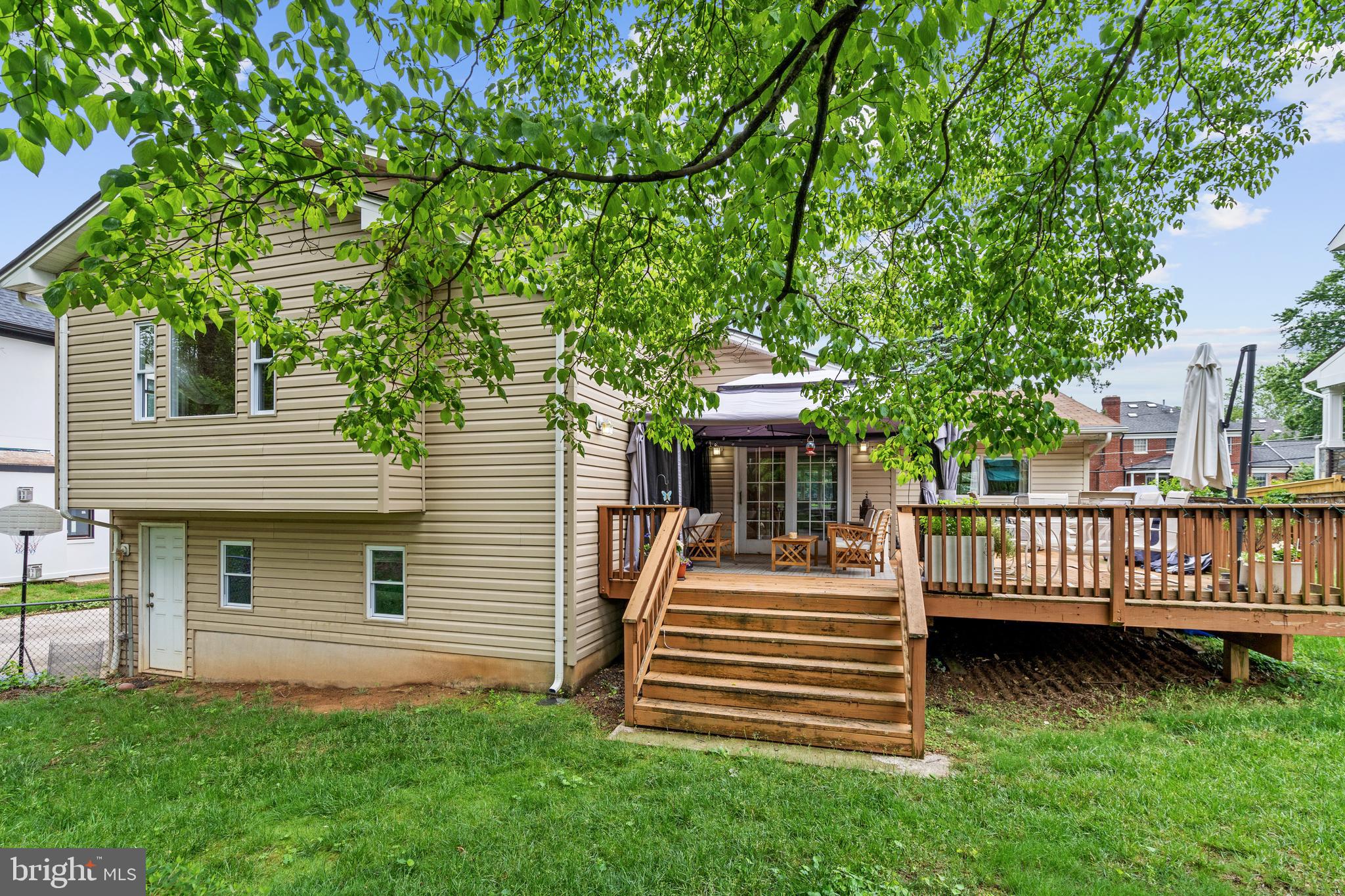 6823 Churchill Road McLean, VA 22101 - Photo 9 of 40 a front view of a house with a garden