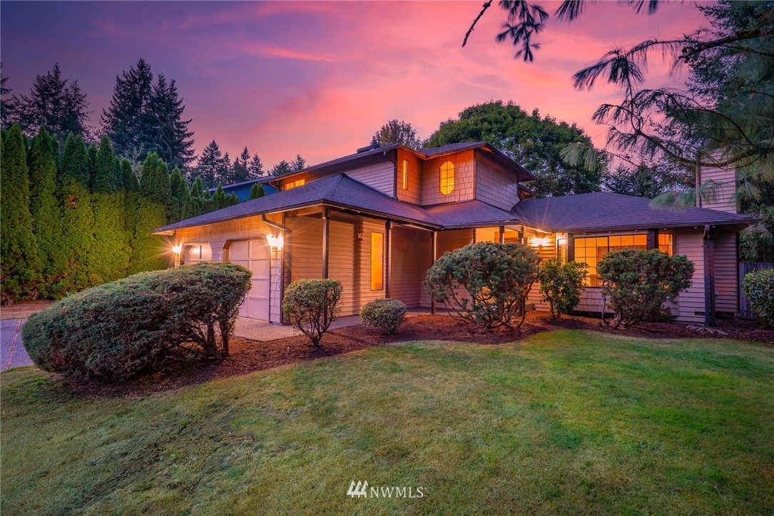 13024 Northeast 184th Place Bothell, WA 98011 - Photo 1 of 27 a view of a house with a yard fire pit and outdoor seating