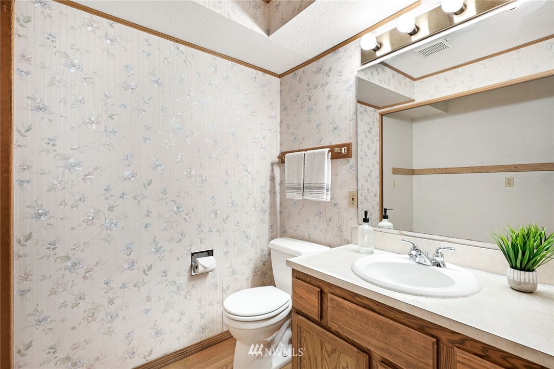 13024 Northeast 184th Place Bothell, WA 98011 - Photo 14 of 27 a bathroom with a sink and a mirror