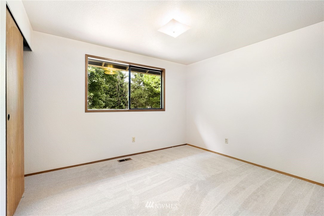 13024 Northeast 184th Place Bothell, WA 98011 - Photo 15 of 27 an empty room with a window