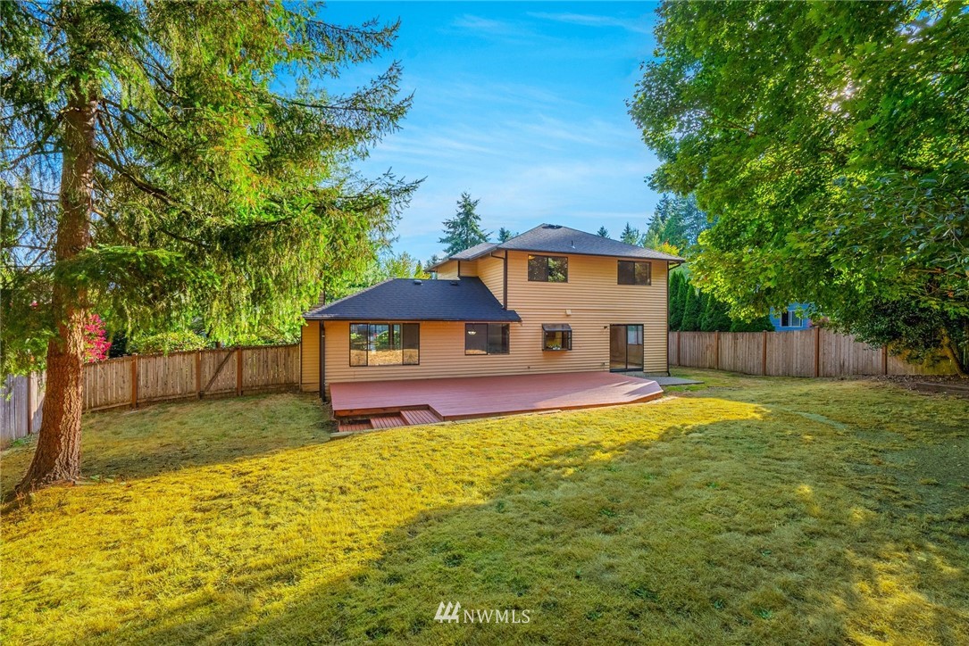 13024 Northeast 184th Place Bothell, WA 98011 - Photo 18 of 27 a house with swimming pool in front of it
