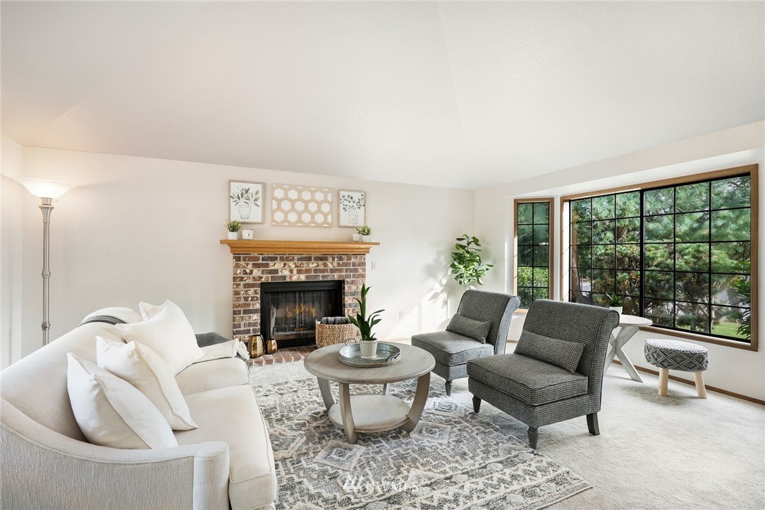 13024 Northeast 184th Place Bothell, WA 98011 - Photo 3 of 27 a living room with furniture and a fireplace