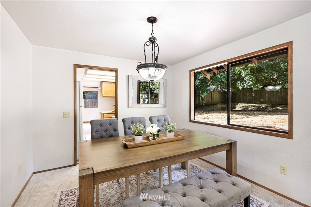 13024 Northeast 184th Place Bothell, WA 98011 - Photo 5 of 27 a view of dining room and window