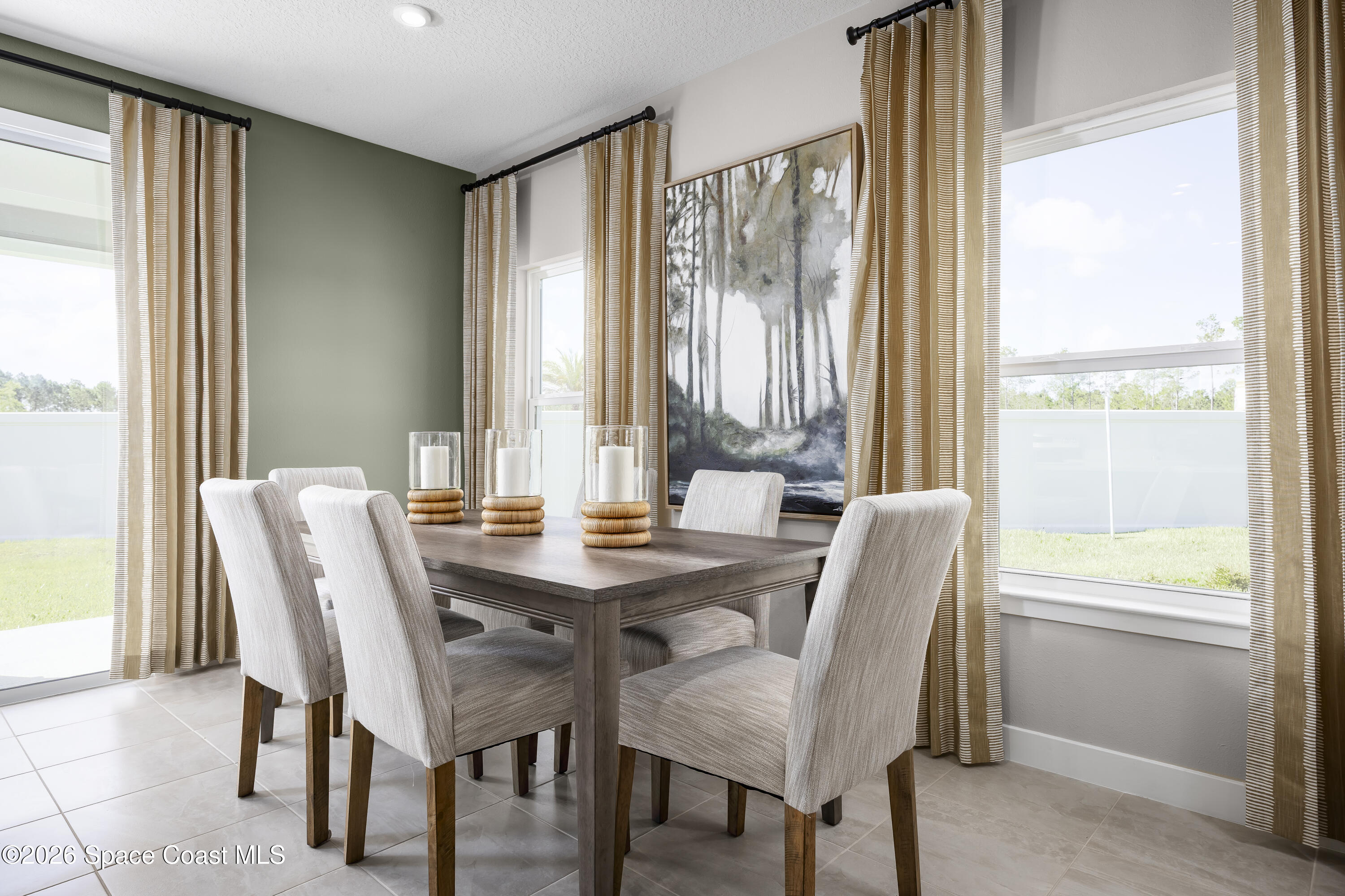 1758 Kendall Pointe Place Melbourne, FL 32935 - Photo 10 of 15 a view of a dining room with furniture and a window