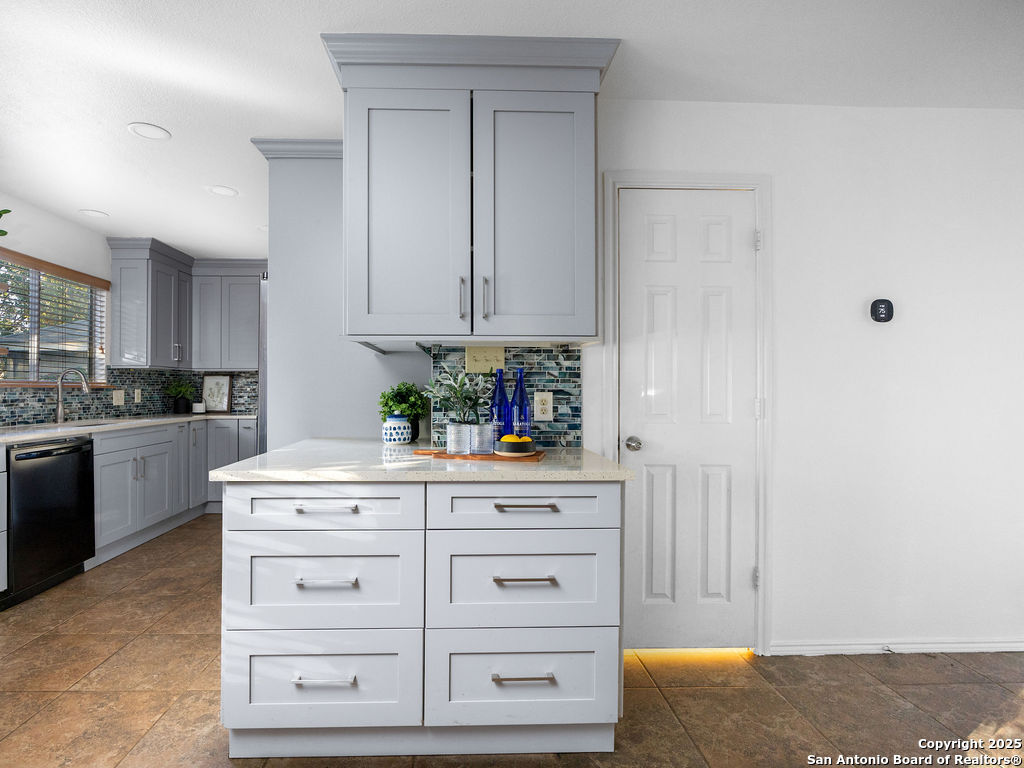 11031 Rindle Ranch San Antonio, TX 78249 - Photo 12 of 45 a kitchen with cabinets appliances and a counter
