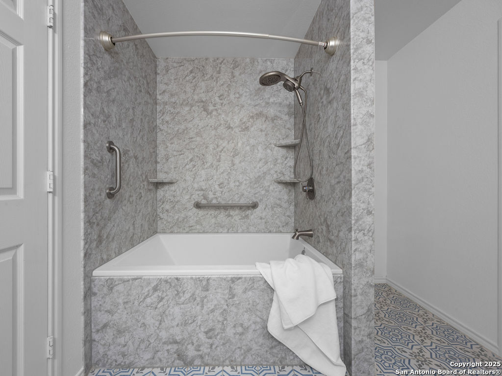 11031 Rindle Ranch San Antonio, TX 78249 - Photo 32 of 45 a bath tub sitting next to a shower