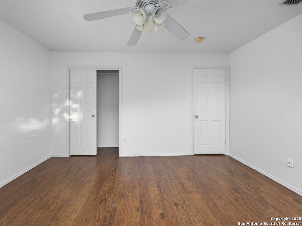 11031 Rindle Ranch San Antonio, TX 78249 - Photo 36 of 45 a view of empty room with wooden floor and ceiling fan
