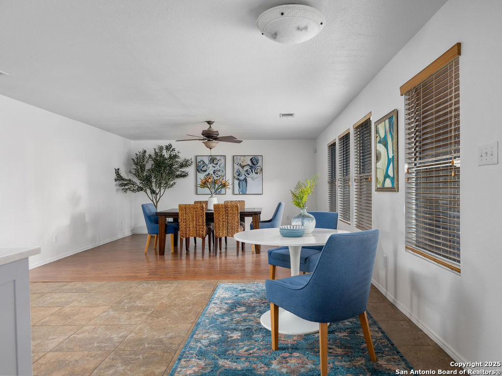 11031 Rindle Ranch San Antonio, TX 78249 - Photo 45 of 45 a view of a dining room with furniture and chandelier