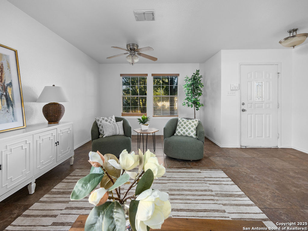 11031 Rindle Ranch San Antonio, TX 78249 - Photo 6 of 45 a living room with furniture and wooden floor