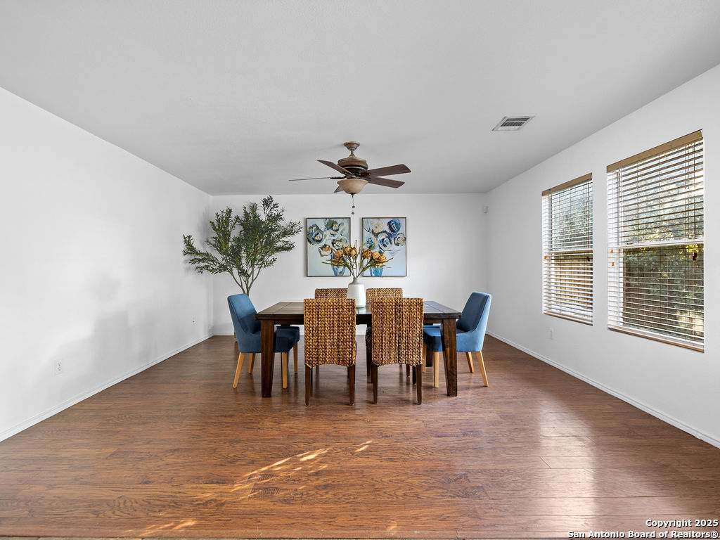 11031 Rindle Ranch San Antonio, TX 78249 - Photo 8 of 45 a view of a dining room with furniture window and wooden floor