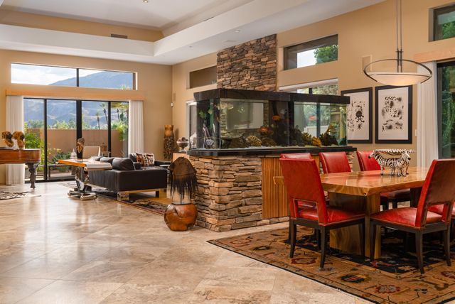 a living room with furniture a window and a fireplace