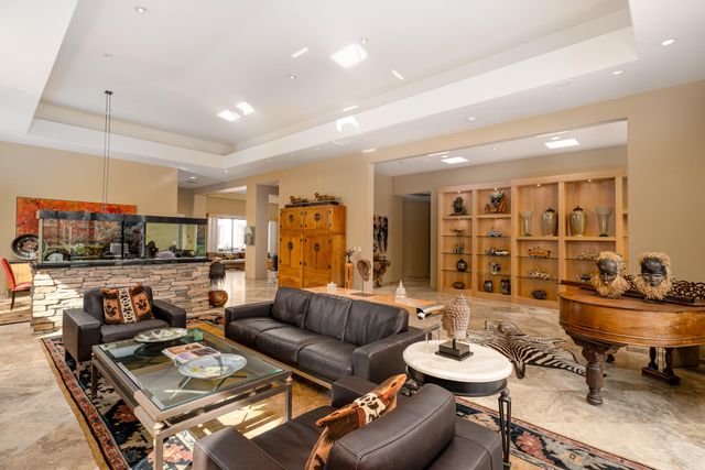 a living room with furniture and a table