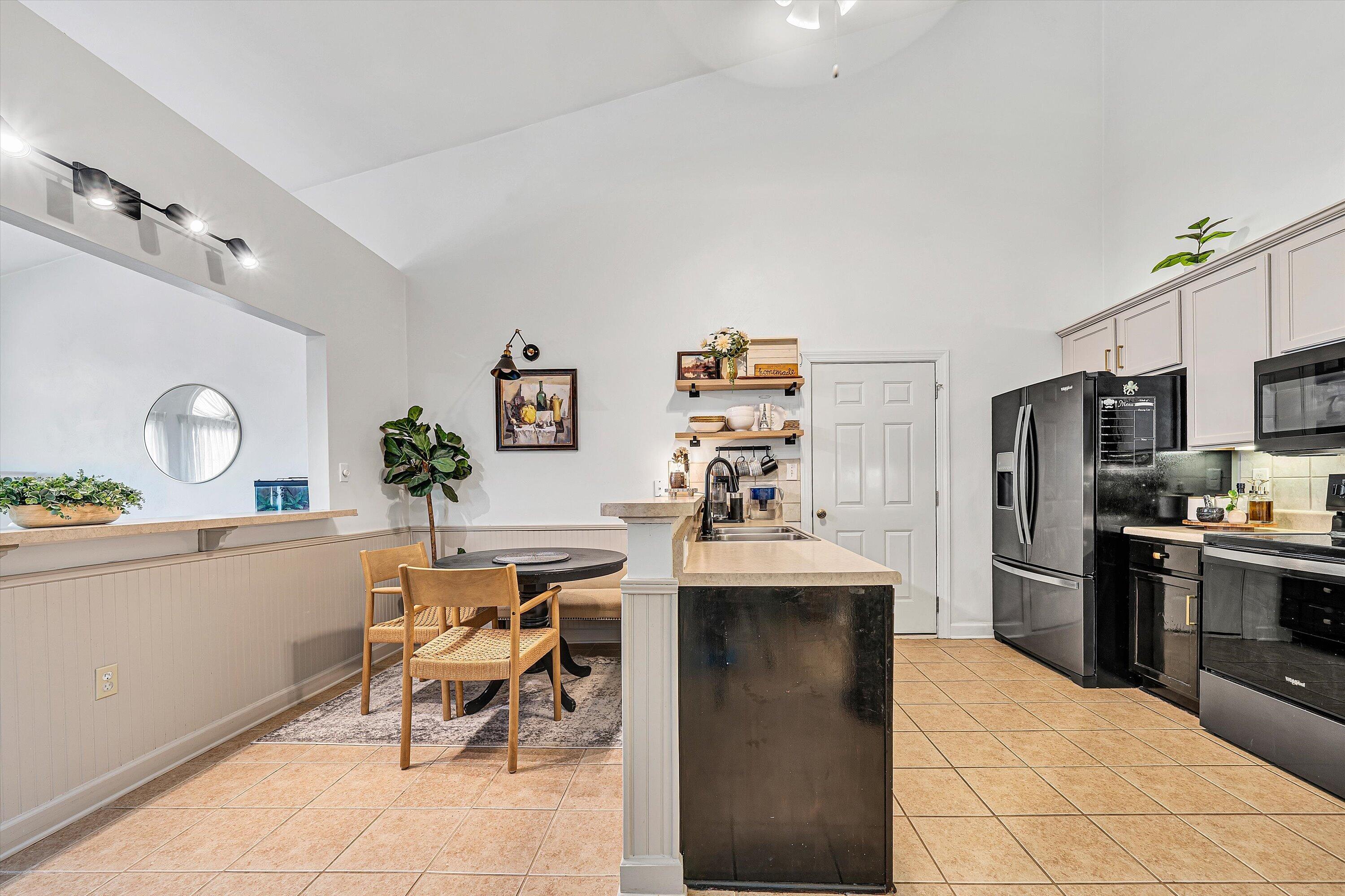 5424 Quail Ridge Court Roanoke, VA 24018 - Photo 11 of 41 a kitchen with stainless steel appliances kitchen island granite countertop a sink and a refrigerator