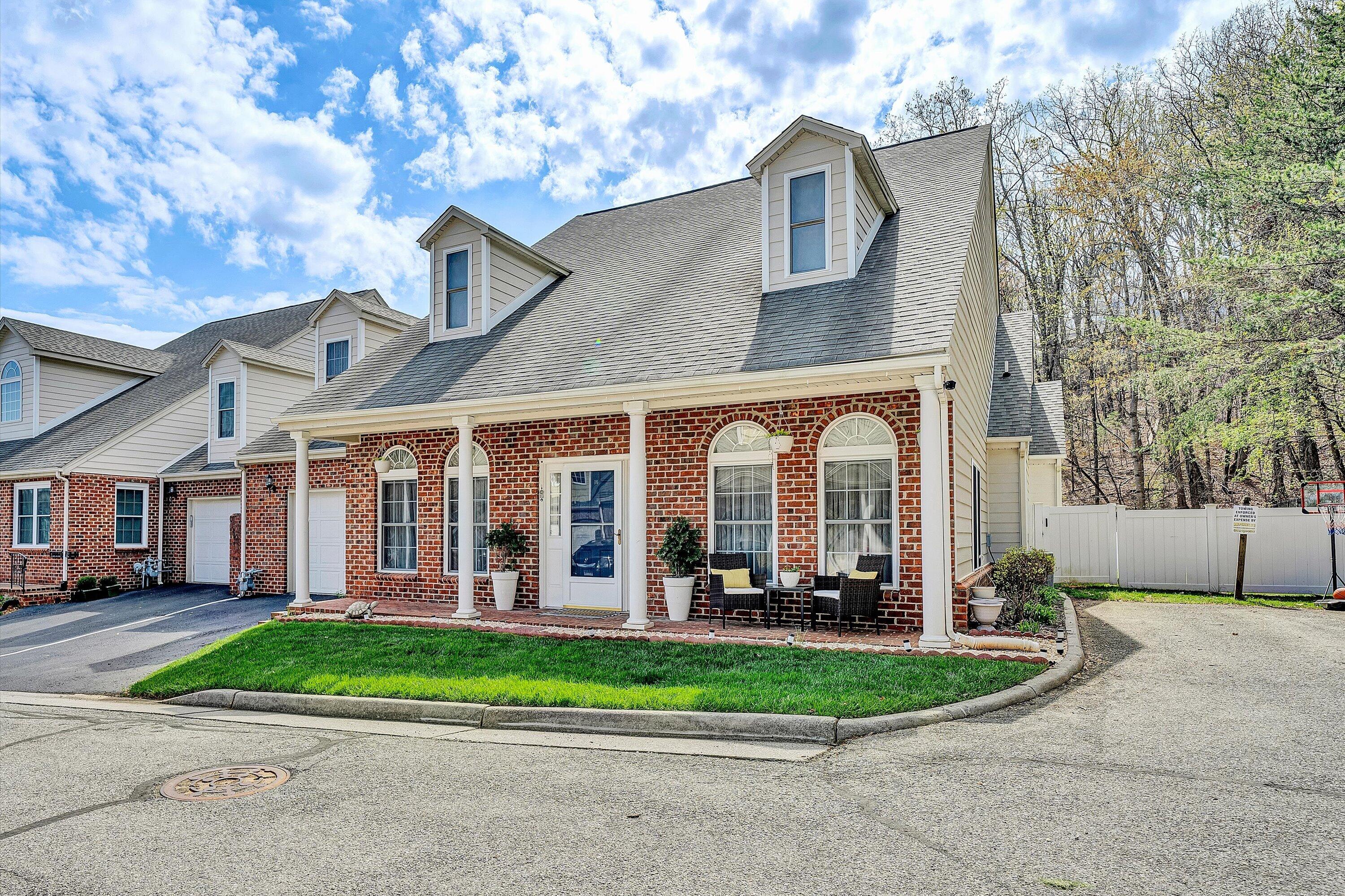 5424 Quail Ridge Court Roanoke, VA 24018 - Photo 2 of 41 a view of a white house with large windows and a large tree