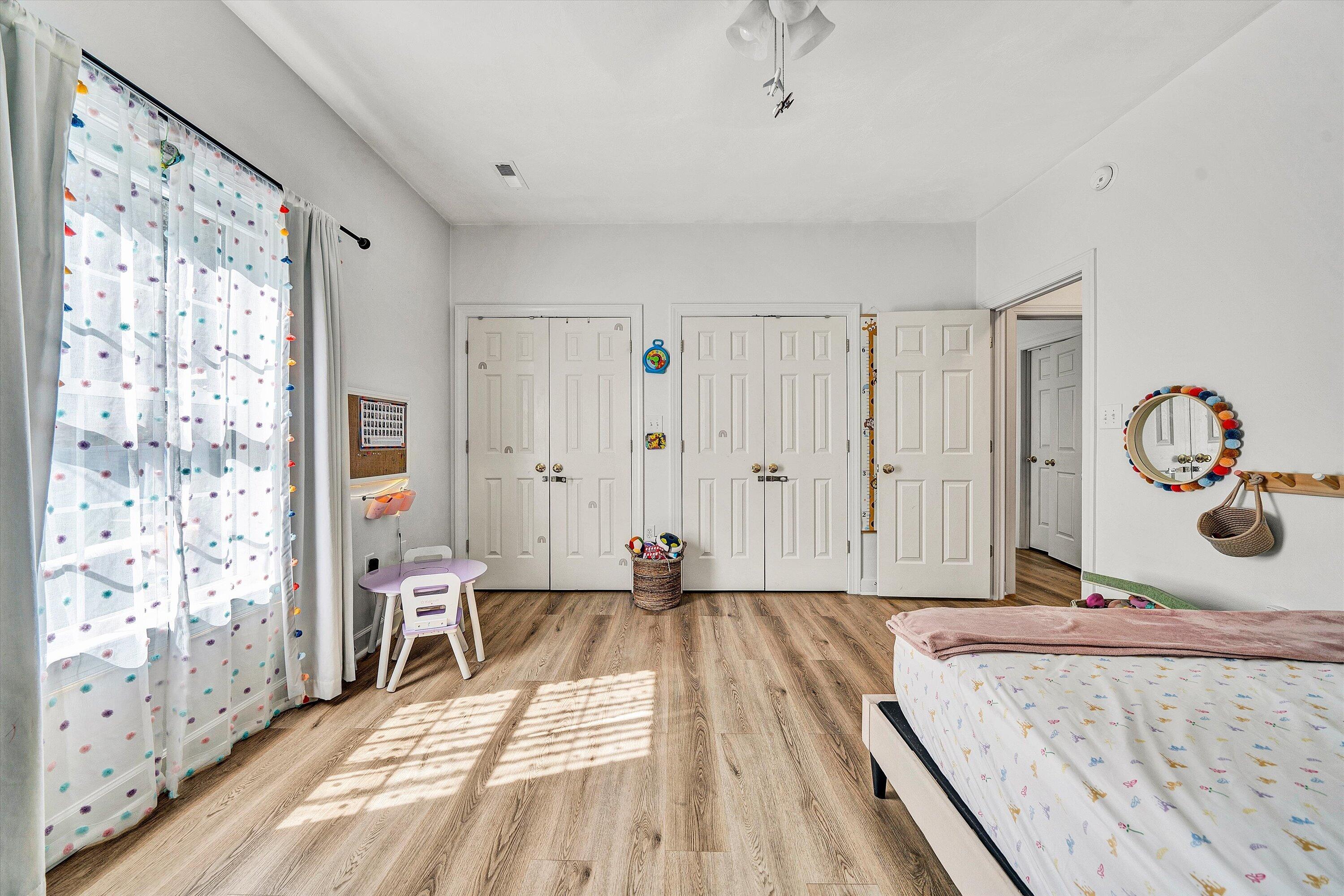 5424 Quail Ridge Court Roanoke, VA 24018 - Photo 29 of 41 a view of a bedroom with wooden floor and windows