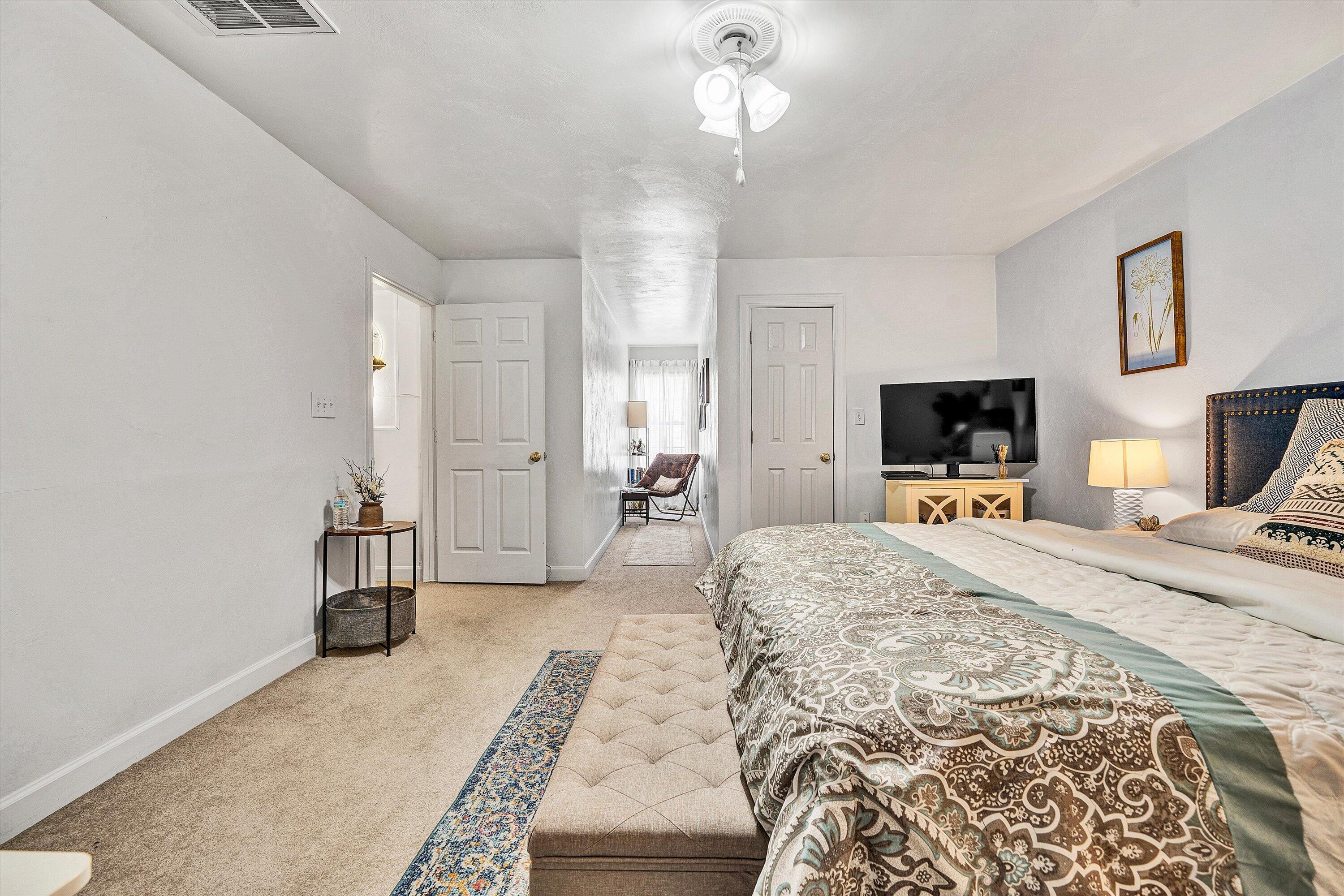 5424 Quail Ridge Court Roanoke, VA 24018 - Photo 34 of 41 a large bedroom with a bed and a flat screen tv