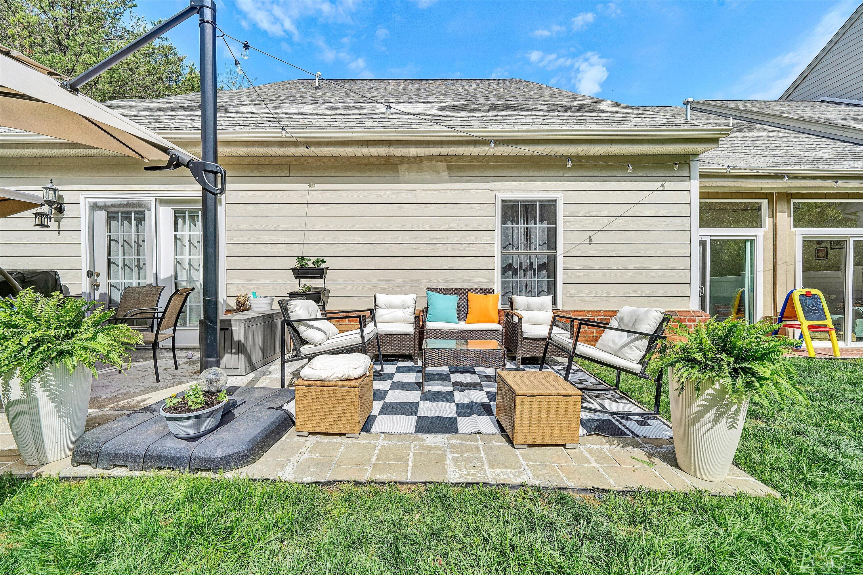 5424 Quail Ridge Court Roanoke, VA 24018 - Photo 37 of 41 a view of a patio with table and chairs and potted plants