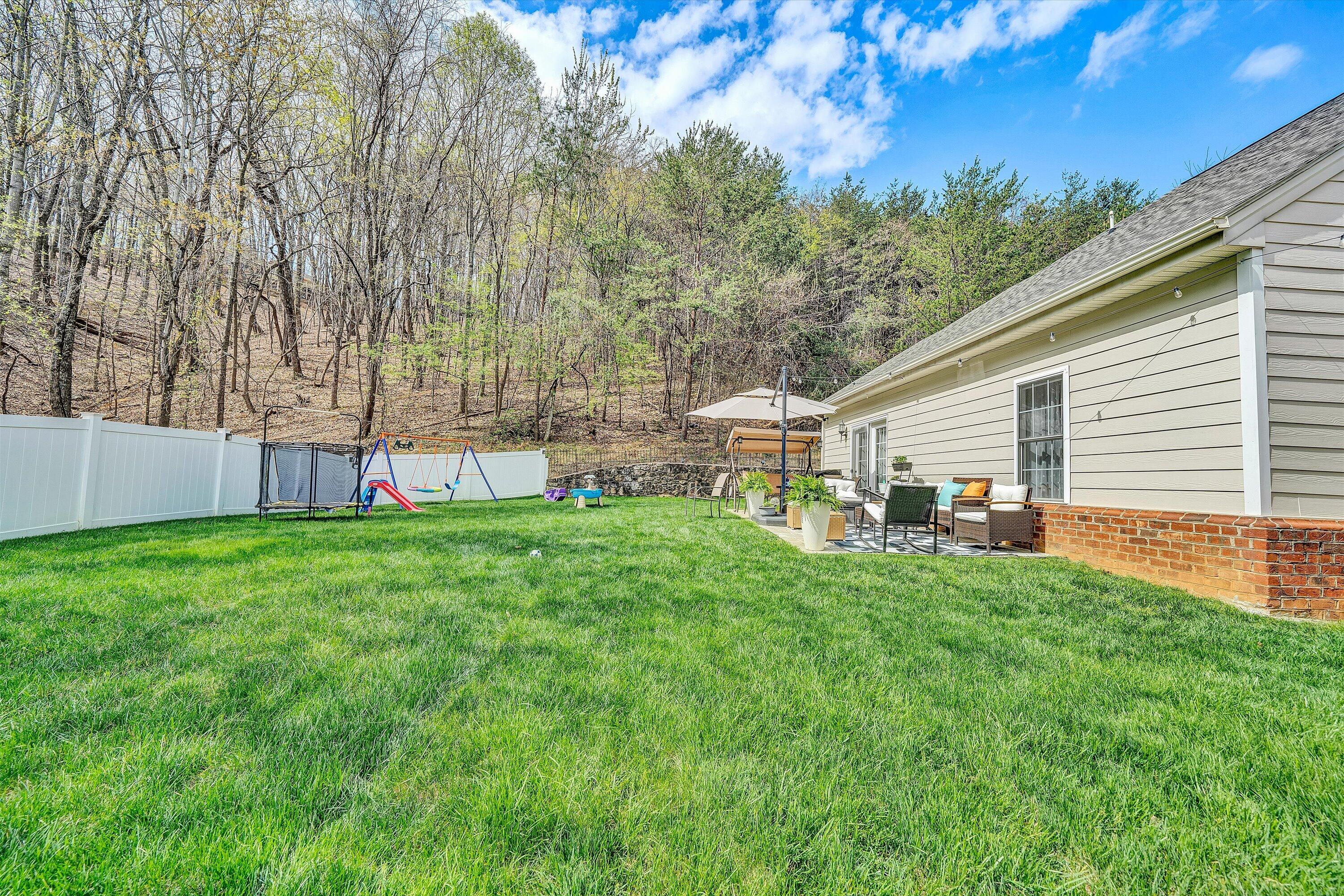 5424 Quail Ridge Court Roanoke, VA 24018 - Photo 38 of 41 a view of a backyard with a garden