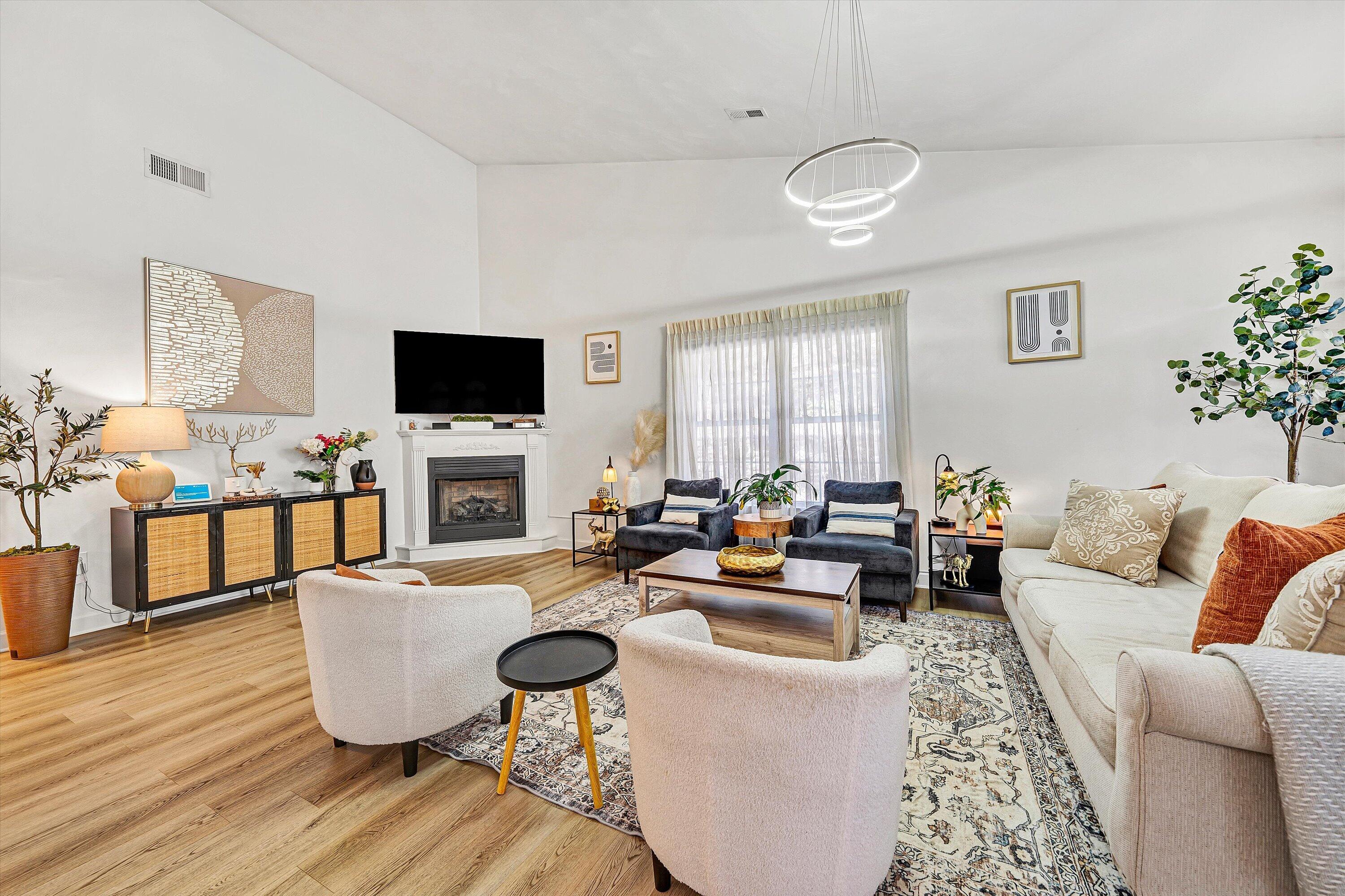 5424 Quail Ridge Court Roanoke, VA 24018 - Photo 5 of 41 a living room with furniture a fireplace and a flat screen tv