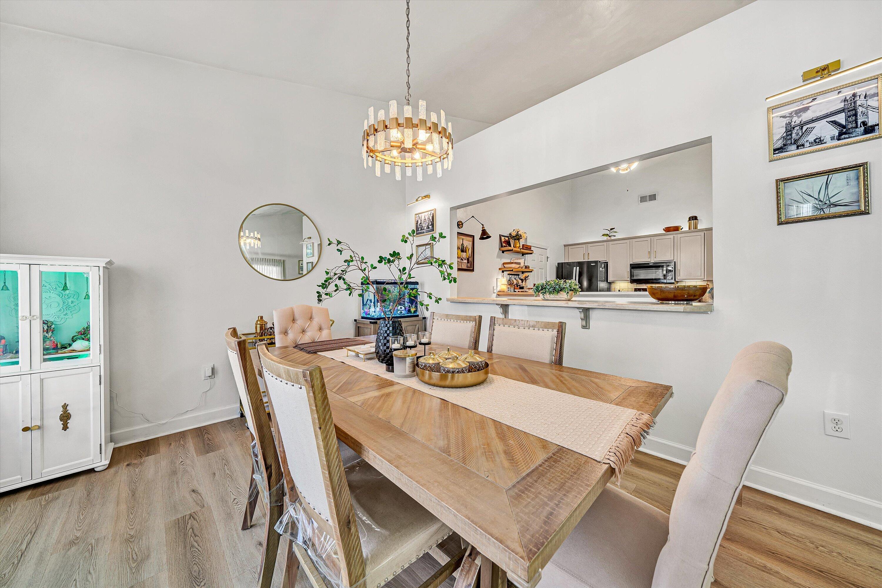 5424 Quail Ridge Court Roanoke, VA 24018 - Photo 7 of 41 a view of a dining room with furniture wooden floor and chandelier