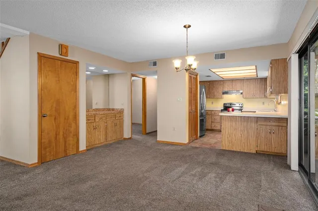 a kitchen with stainless steel appliances granite countertop a sink and cabinets