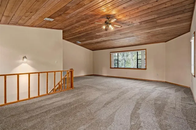 a spacious bathroom with a double vanity sink a mirror and a bathtub
