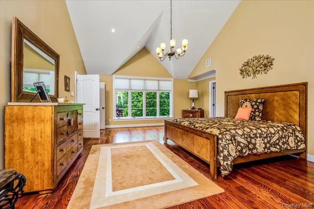 a living room with furniture a floor to ceiling window and a fireplace