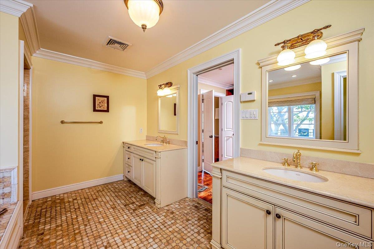 83 Ithaca Avenue Atlantic Beach, NY 11509 - Photo 23 of 45 Full bath with crown molding and two vanities